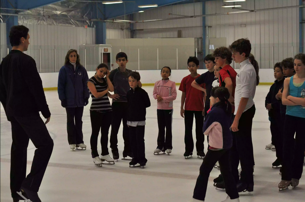 Alexei Kiliakov coaching figure skaters.