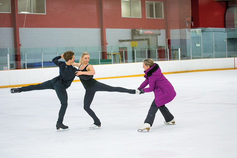 Elana Novak coaching Rachel and Michael Parsons.